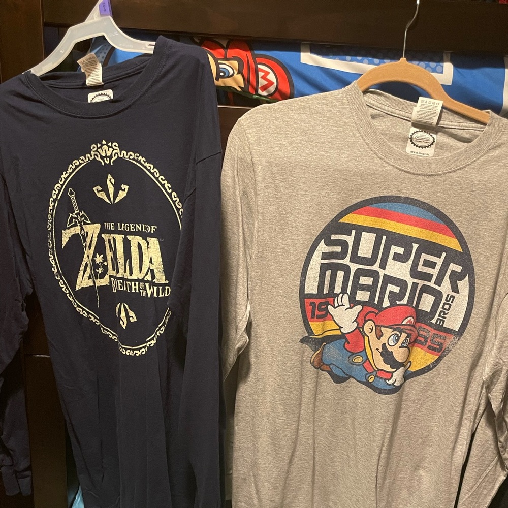 Assortment of graphic long sleeve T-shirts.